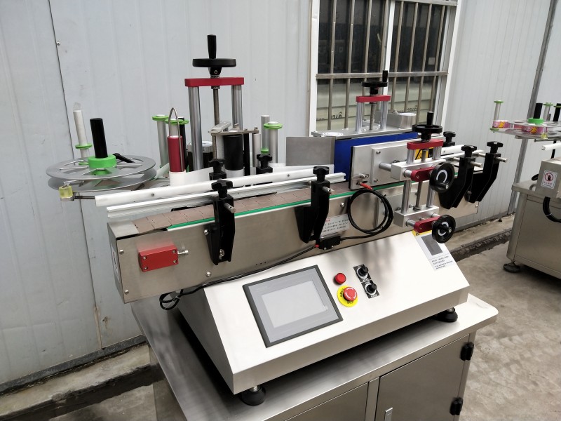 Automatic tabletop round bottle labeling machine